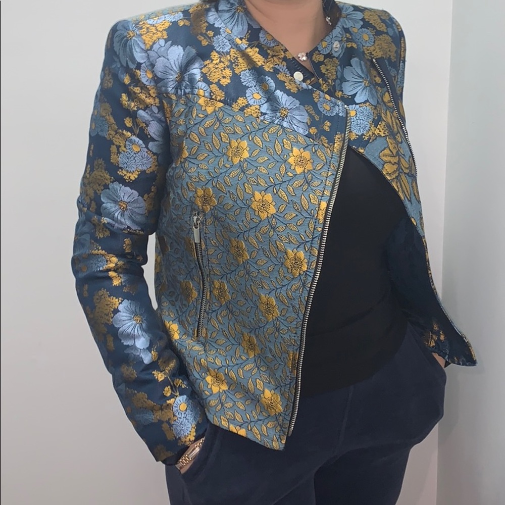 Blue and gold jacket.